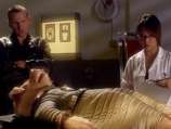 The Doctor Watching Sato Examining the Alien Pig